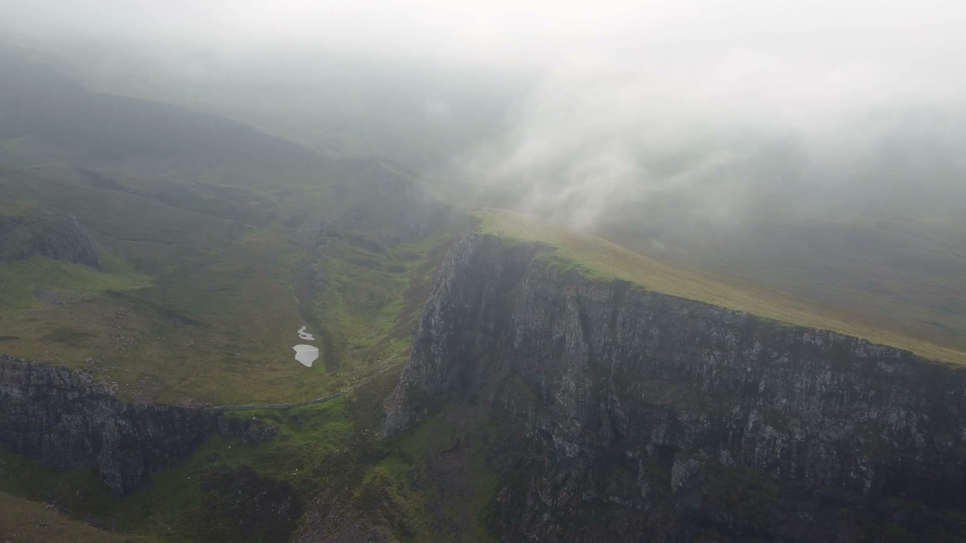 Aerial view of the misty Quiraing ridge on the Isle of Skye, Scotland